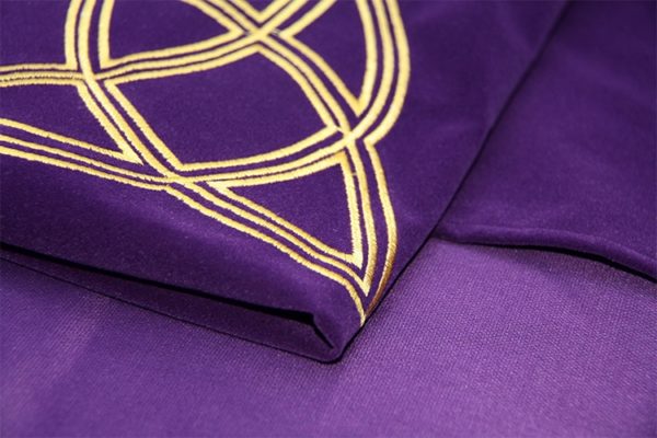 A close up of a purple blanket